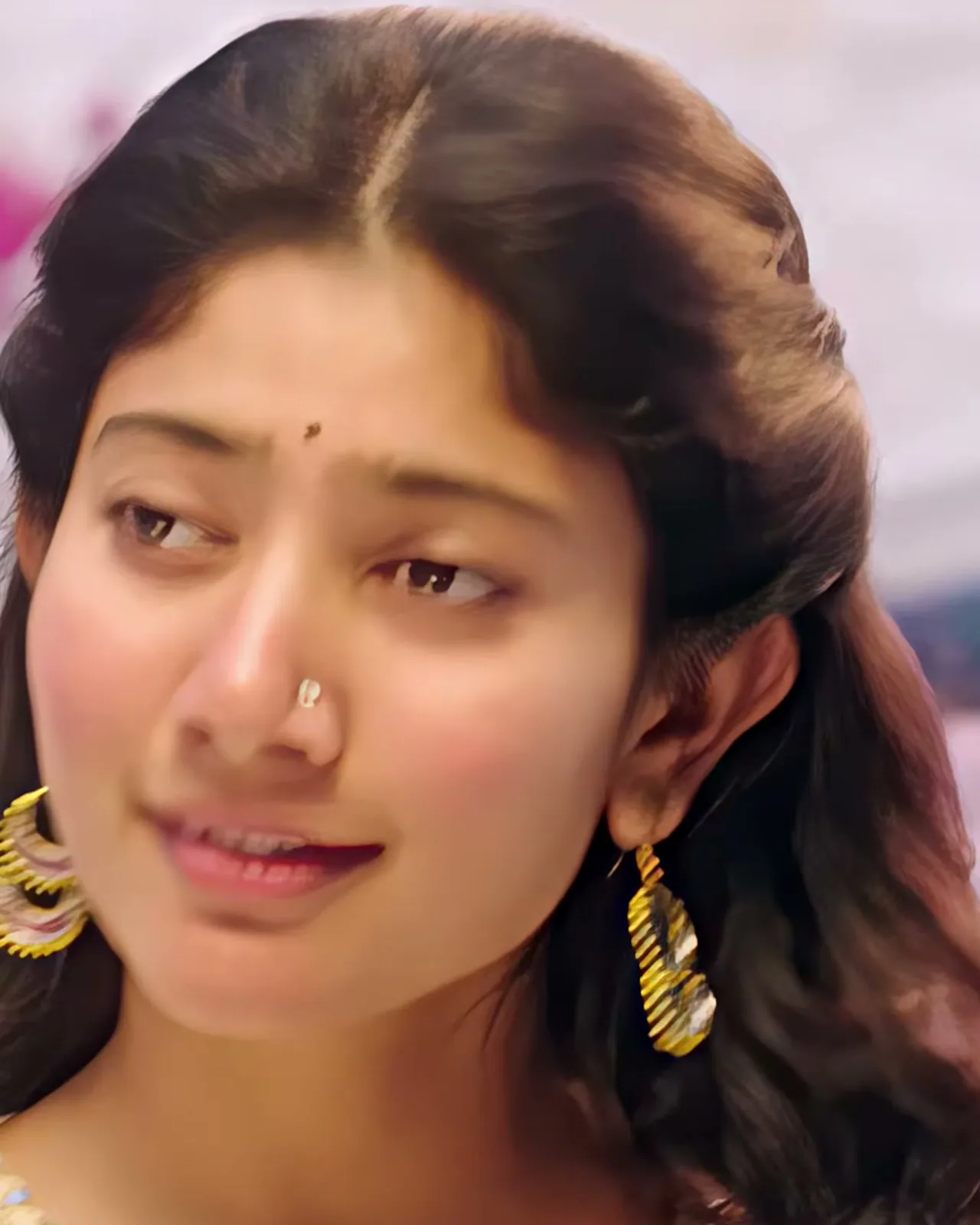 Sai Pallavi — Close on the fluted gold drop earrings and the small nose stud