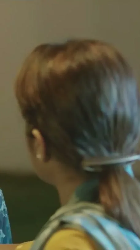 Trisha Krishnan — Closer on the ponytail and the stole across the shoulder