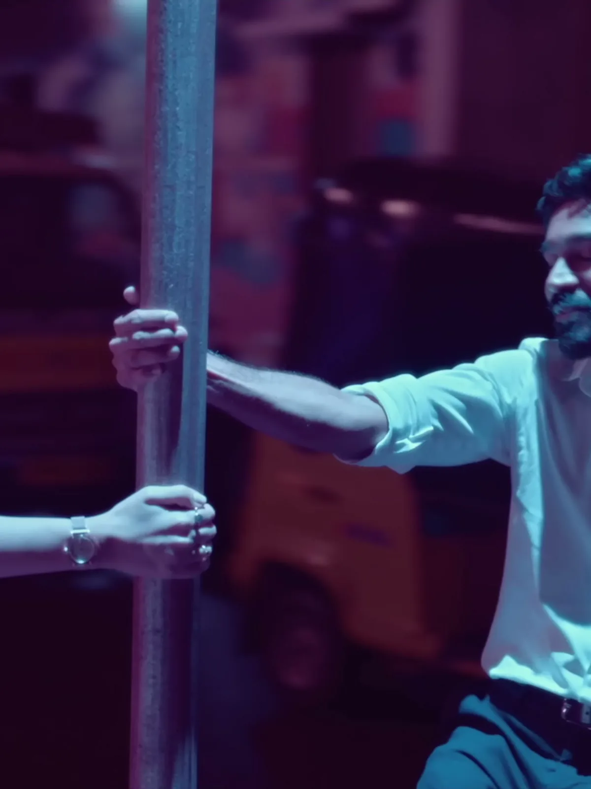 Dhanush — Against the pole: the shirt tucked in, and the plain black belt