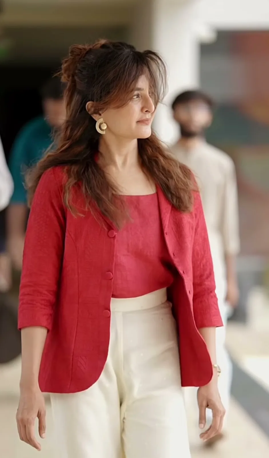 Manju Warrier — The whole outfit — red textured jacket worn open over a matching red square-neck top, ivory wide-legs