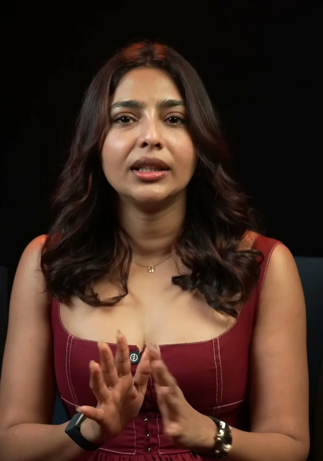 Aishwarya Lekshmi — Mid-sentence — the dropped waist seam where the fitted bodice releases into the gathers