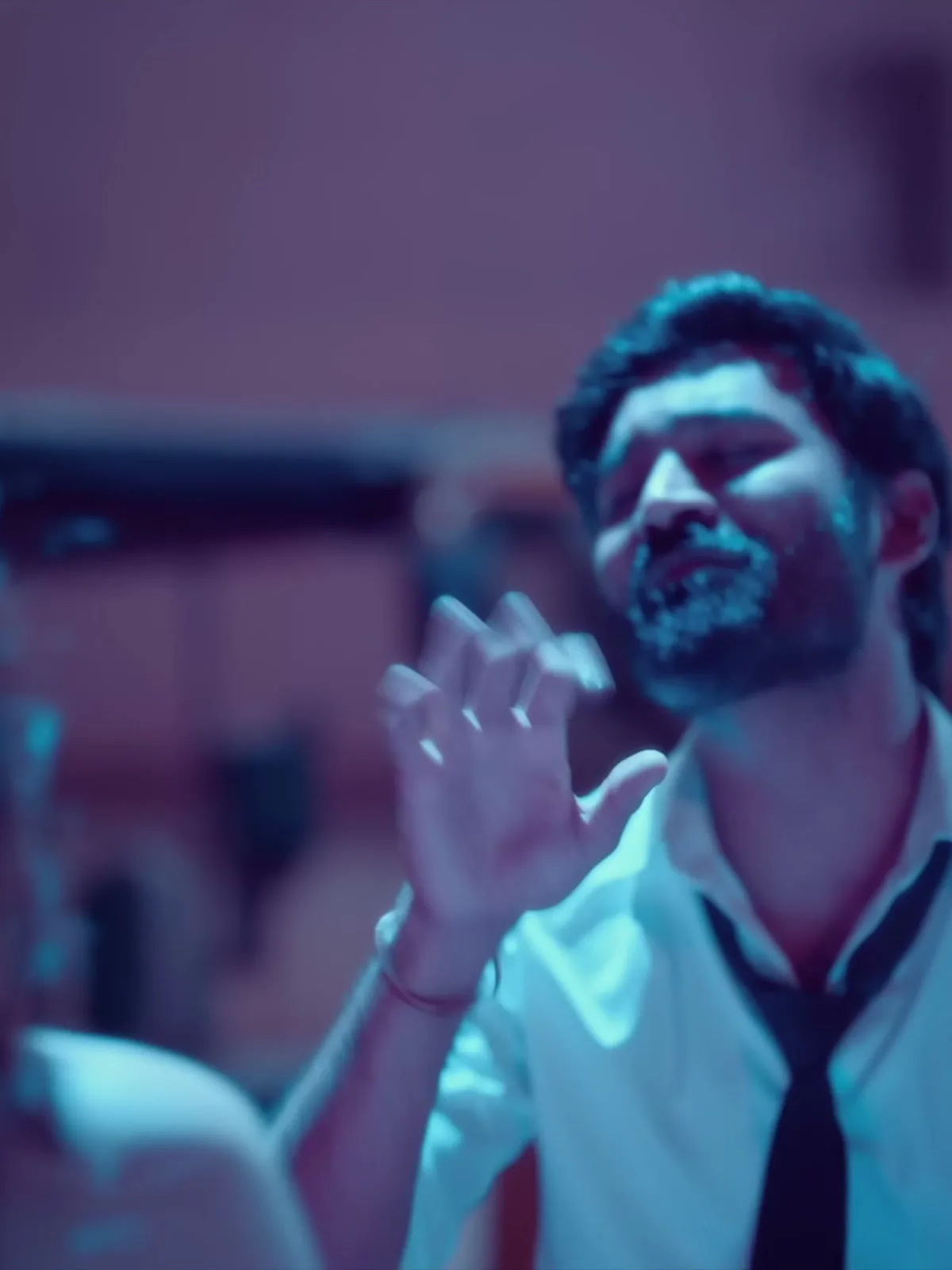 Dhanush — The knot left slack, and how long the skinny tie hangs
