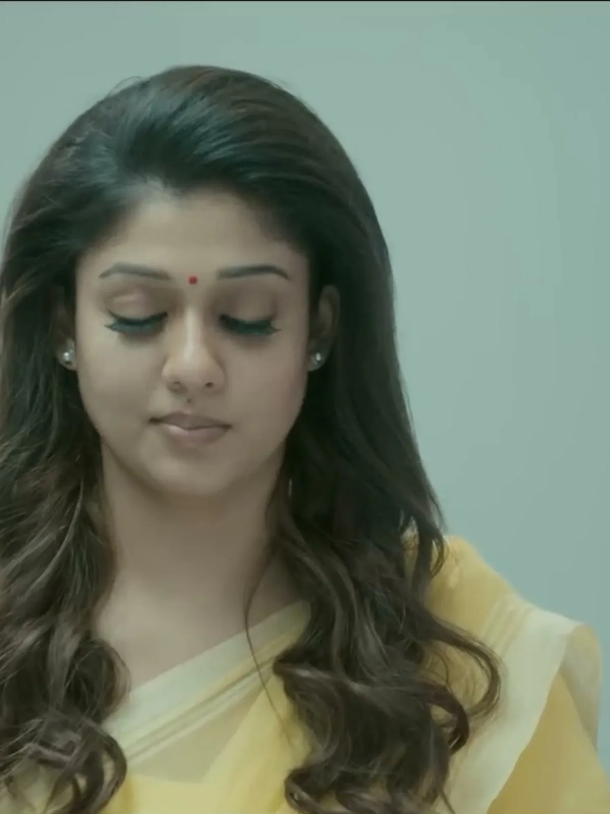 Nayanthara — Close on the border and the plain short-sleeved blouse in the same yellow