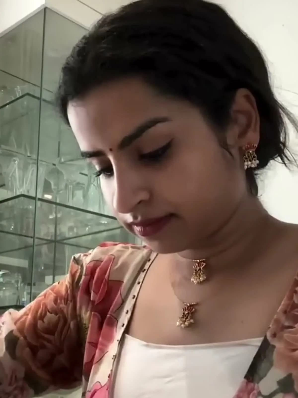 Sivaangi Krishnakumar — Close in on the placket — the narrow contrast edge and its line of small dark studs