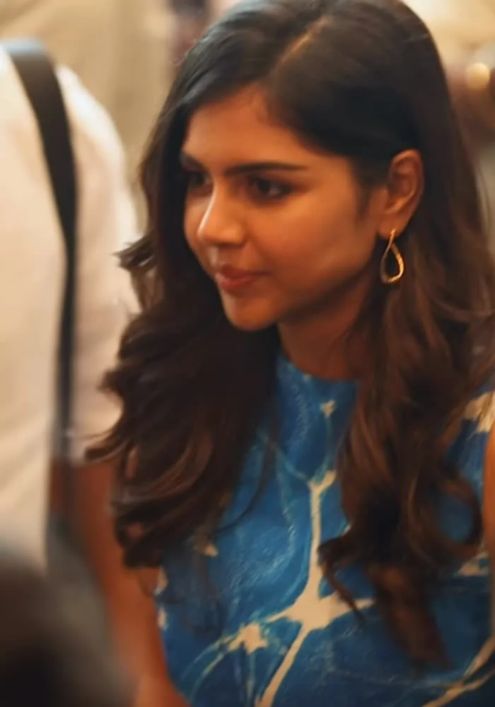 Kalyani Priyadarshan — Close on the bodice: white branching veins through solid cobalt, and one gold hoop