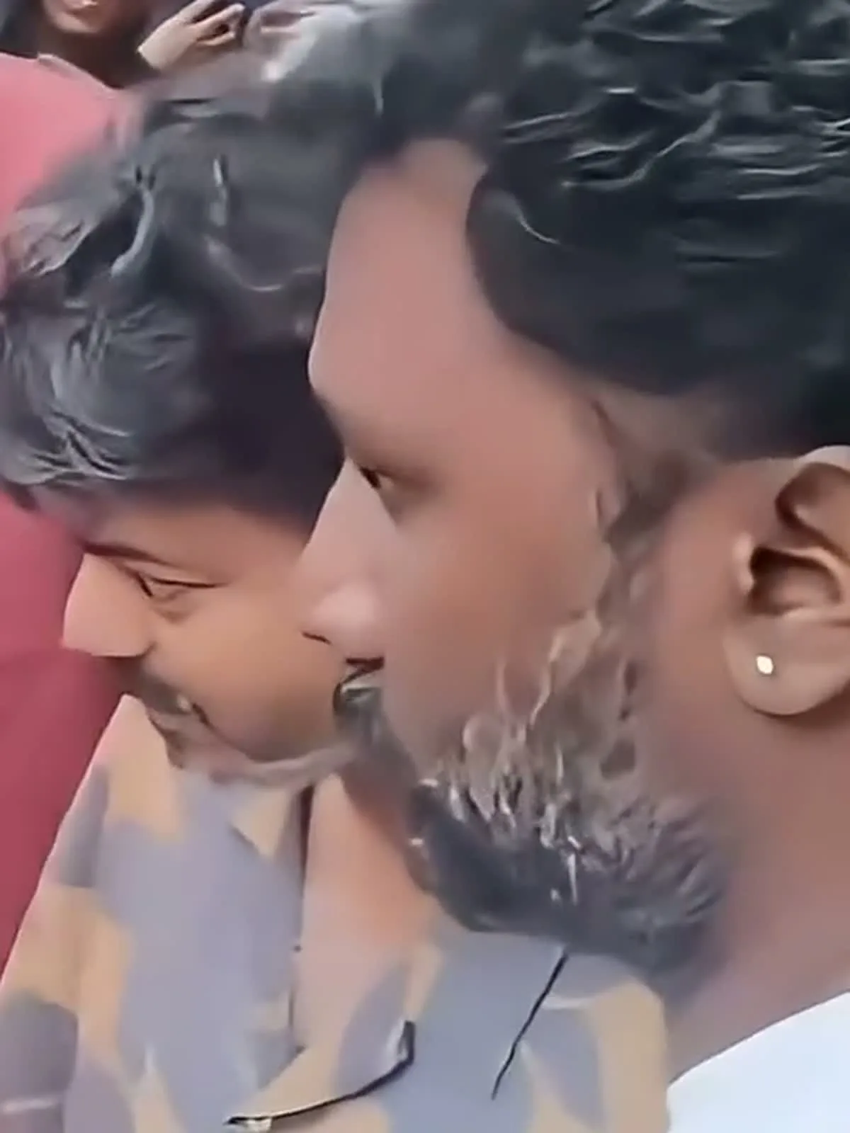 Vijay — In profile: the flat notched camp collar lying open rather than standing up