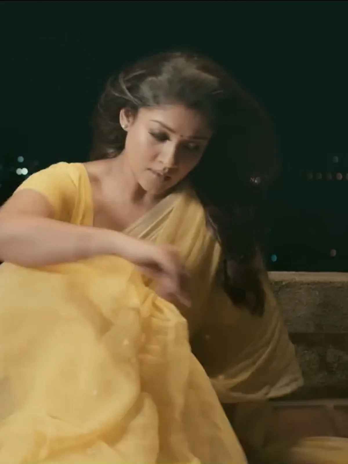 Nayanthara — The pallu folded back over the left shoulder, and how sheer the fabric is