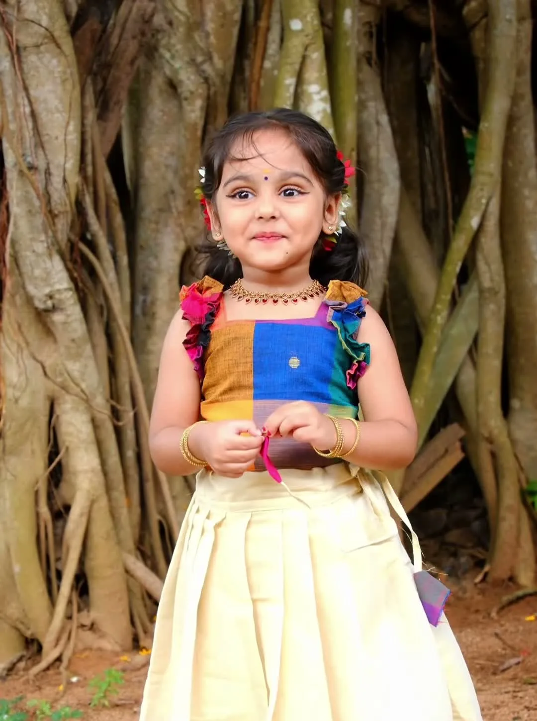 Gautami Gokul — Turned away — how the box pleats fall and how the ruffles sit off the shoulder