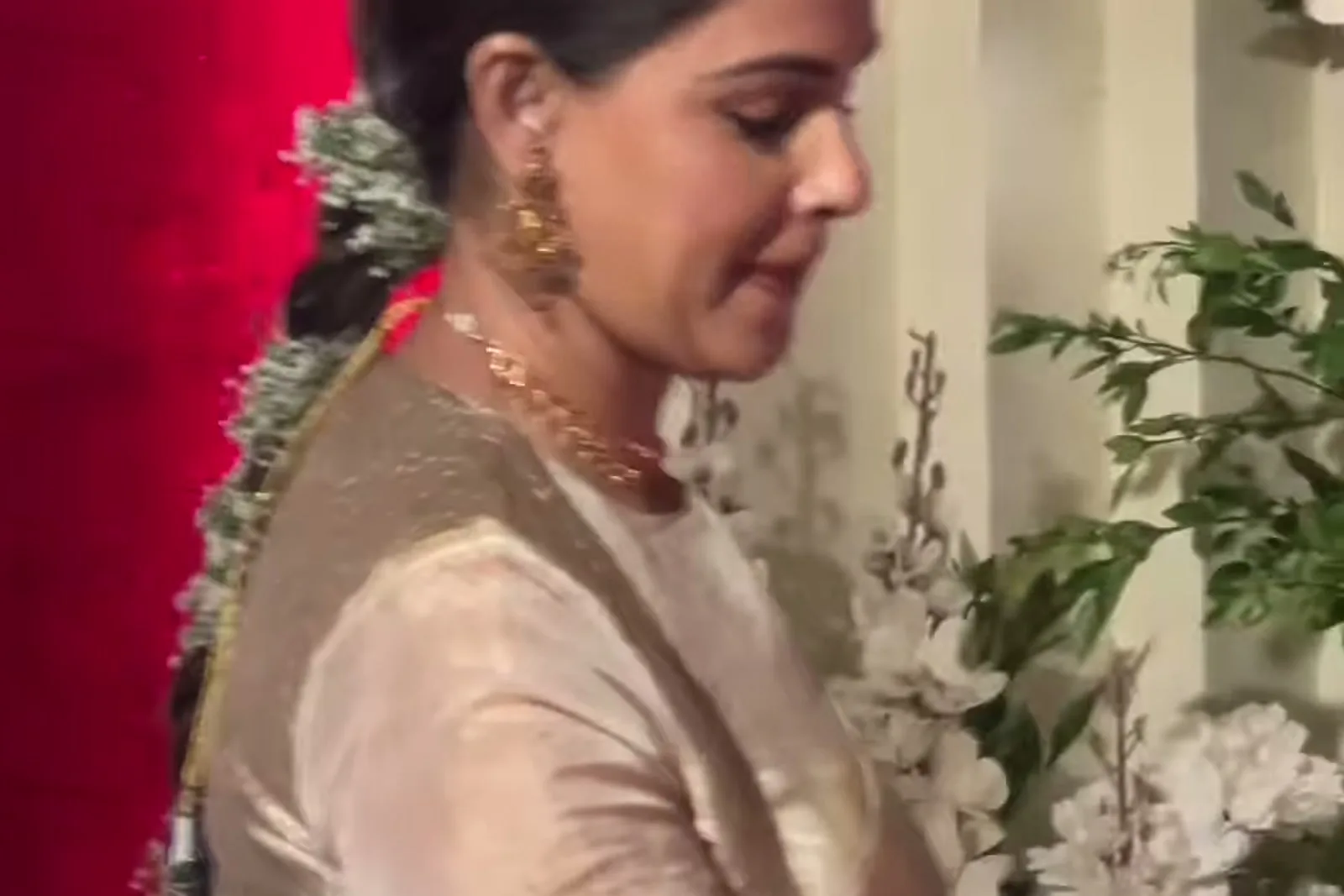Genelia D’Souza — Walking out — the jasmine strand down the braid and the full sleeve running to the wrist