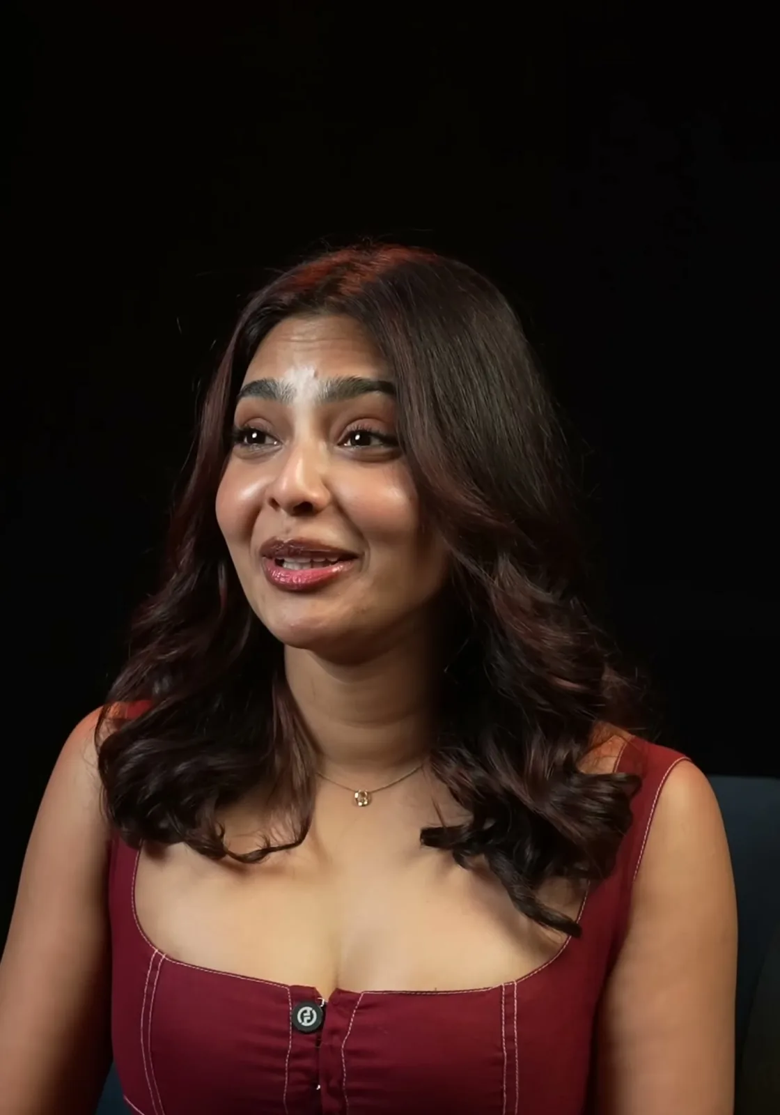 Aishwarya Lekshmi — Hands open — how the matte linen-cotton holds its own folds instead of catching the light