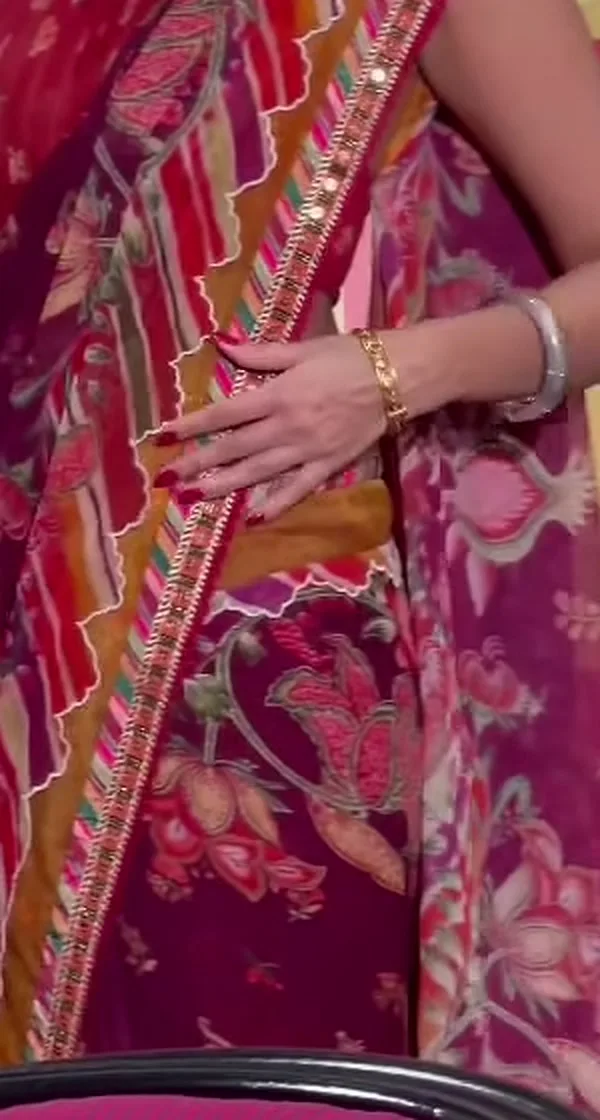 Anupama Parameswaran — The scalloped ivory edge and the striped border running the length of the saree