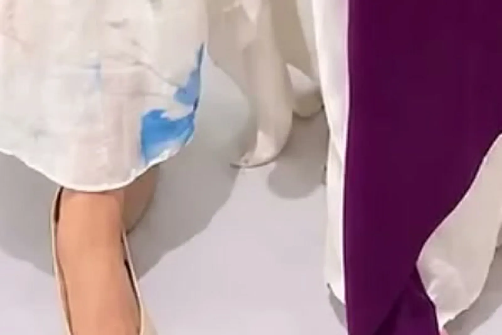 Shalini Ajith — The hem falling to mid-calf, over plain cream round-toe flats