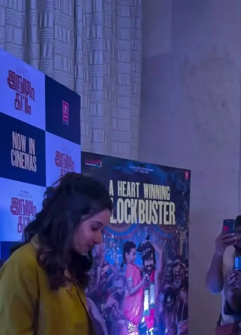 Priya Bhavani Shankar — On the carpet — the tunic hangs open and straight, with the ivory palazzos underneath