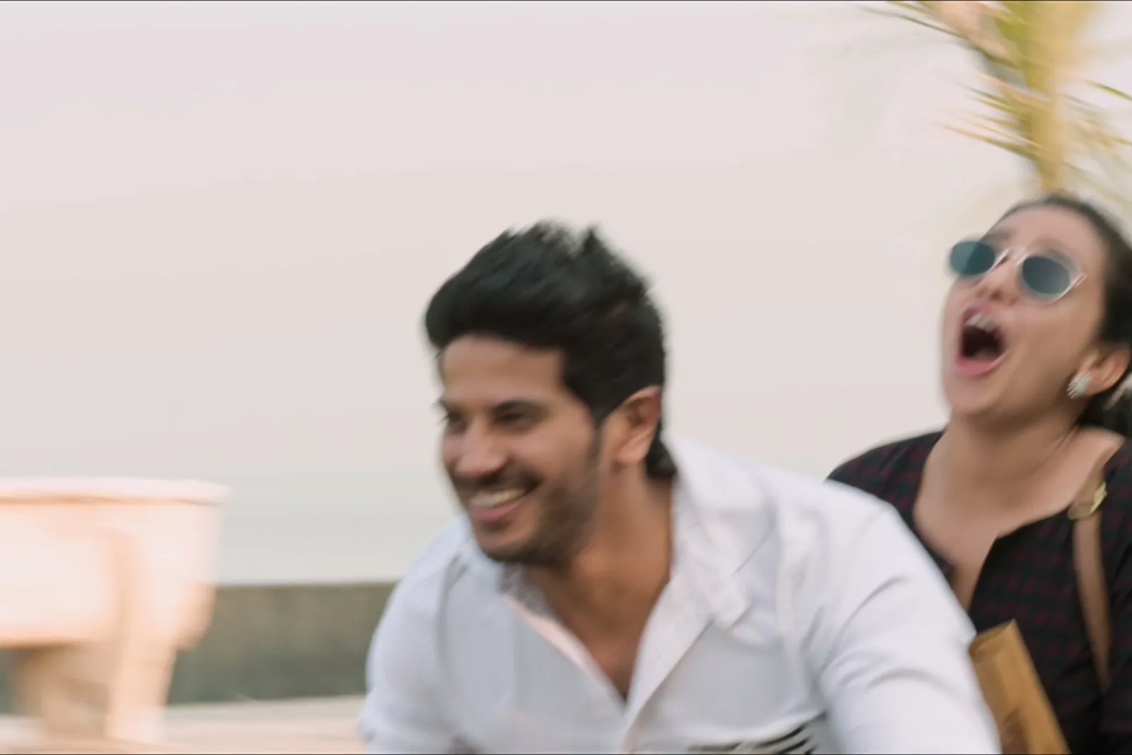 Dulquer Salmaan — Along the sea front, sleeves pushed back to the forearm