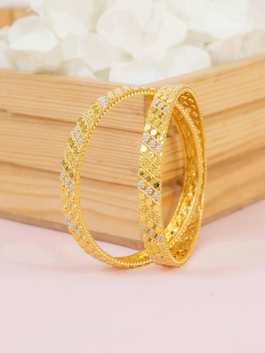 Our pick for the stack — eight thin gold-plated bangles