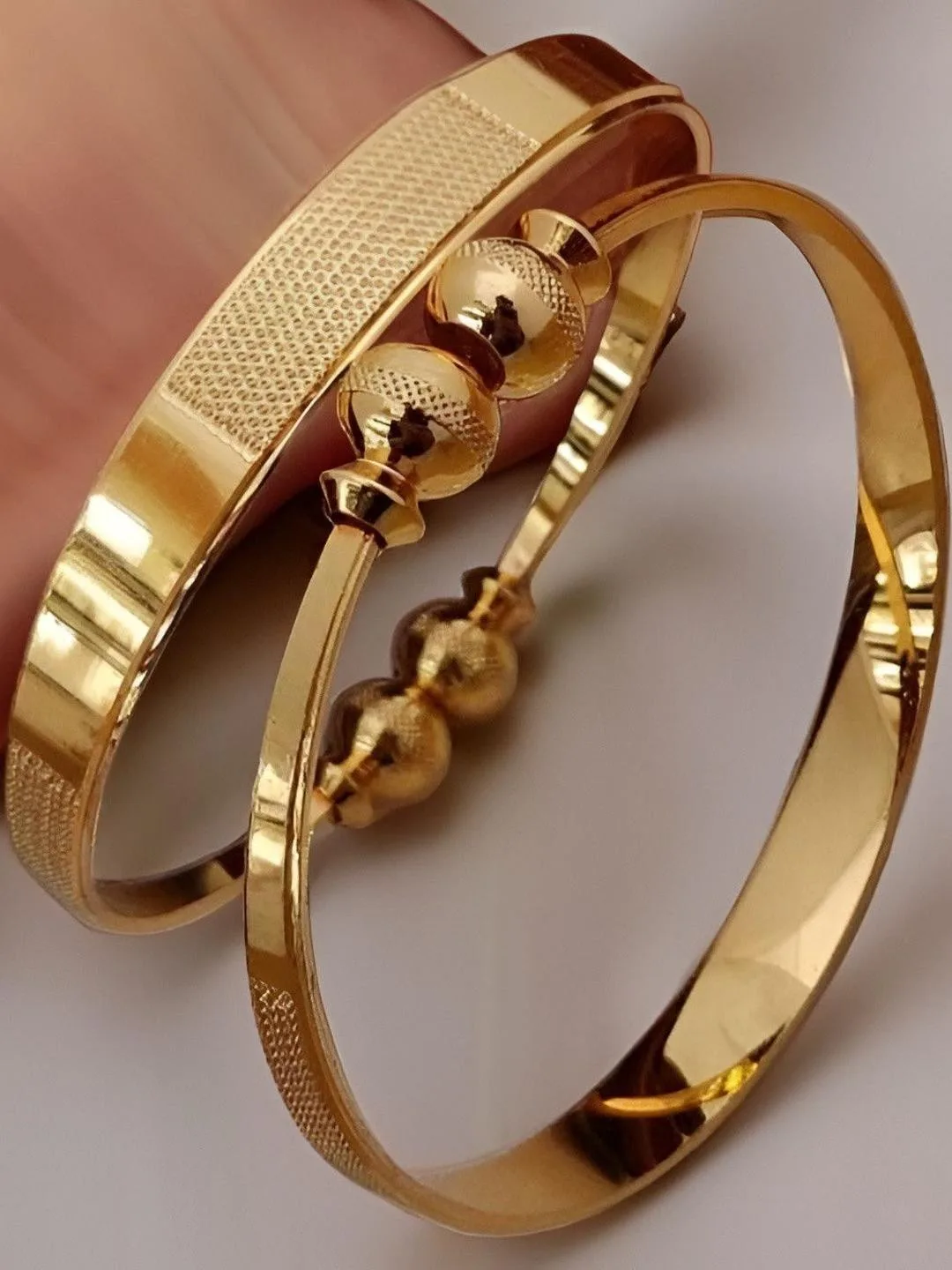 Jewels Kafe Slim gold-toned bangles, set of two