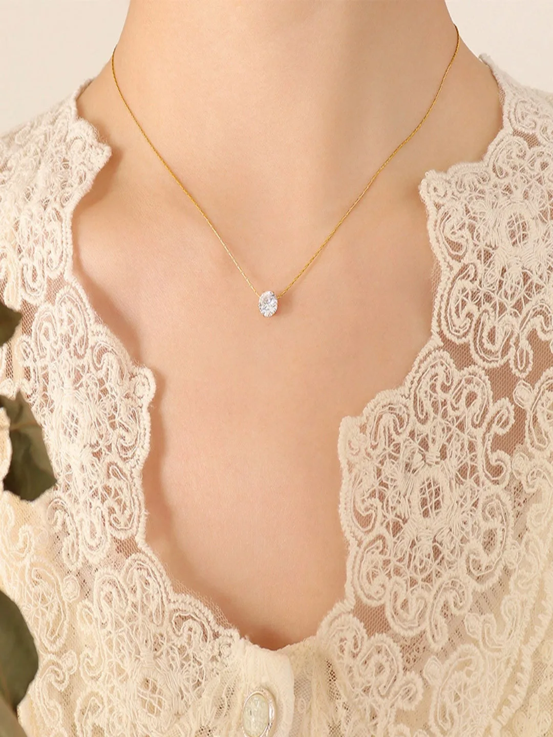 Fine gold-toned chain with a single small pendant