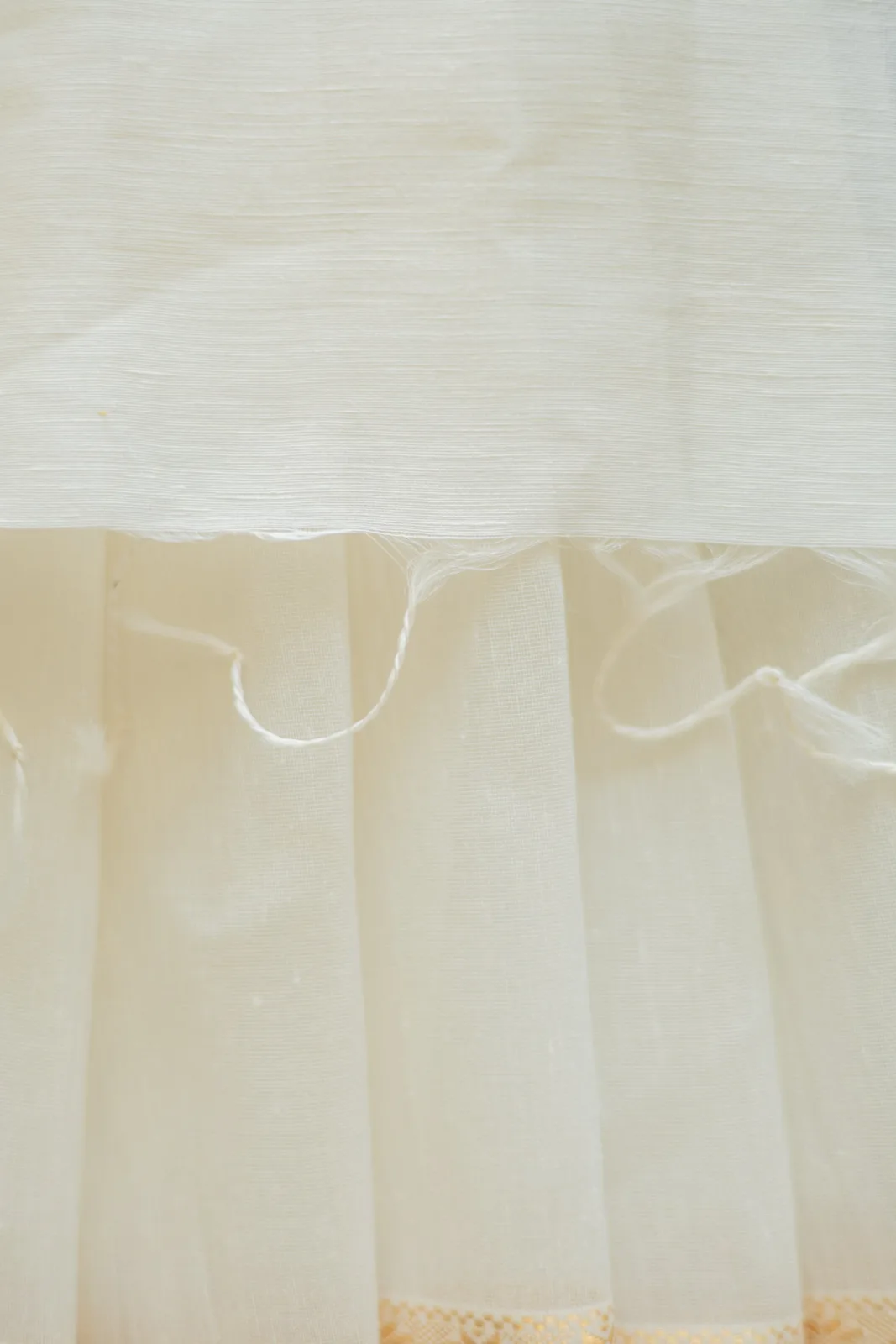 Neela by Anu Vardhan White silk-linen saree with a small gold zari border