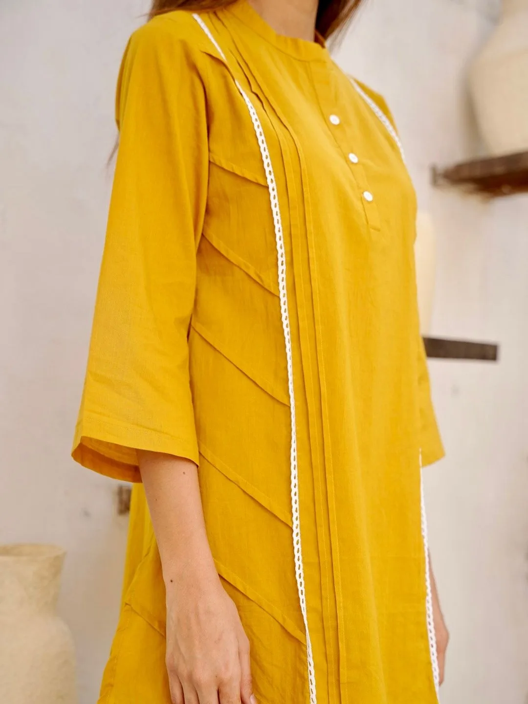 GULABI DORI Our pick under ₹2,300 — mustard kurti and palazzo set with ivory trim