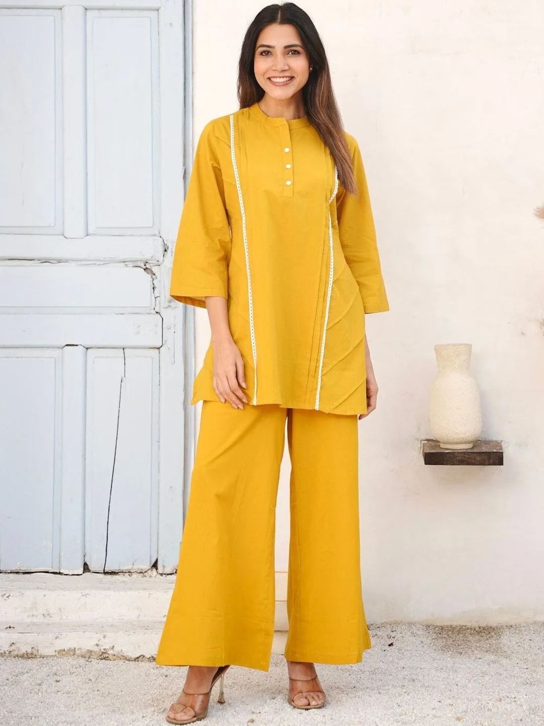 GULABI DORI Our pick under ₹2,300 — mustard kurti and palazzo set with ivory trim