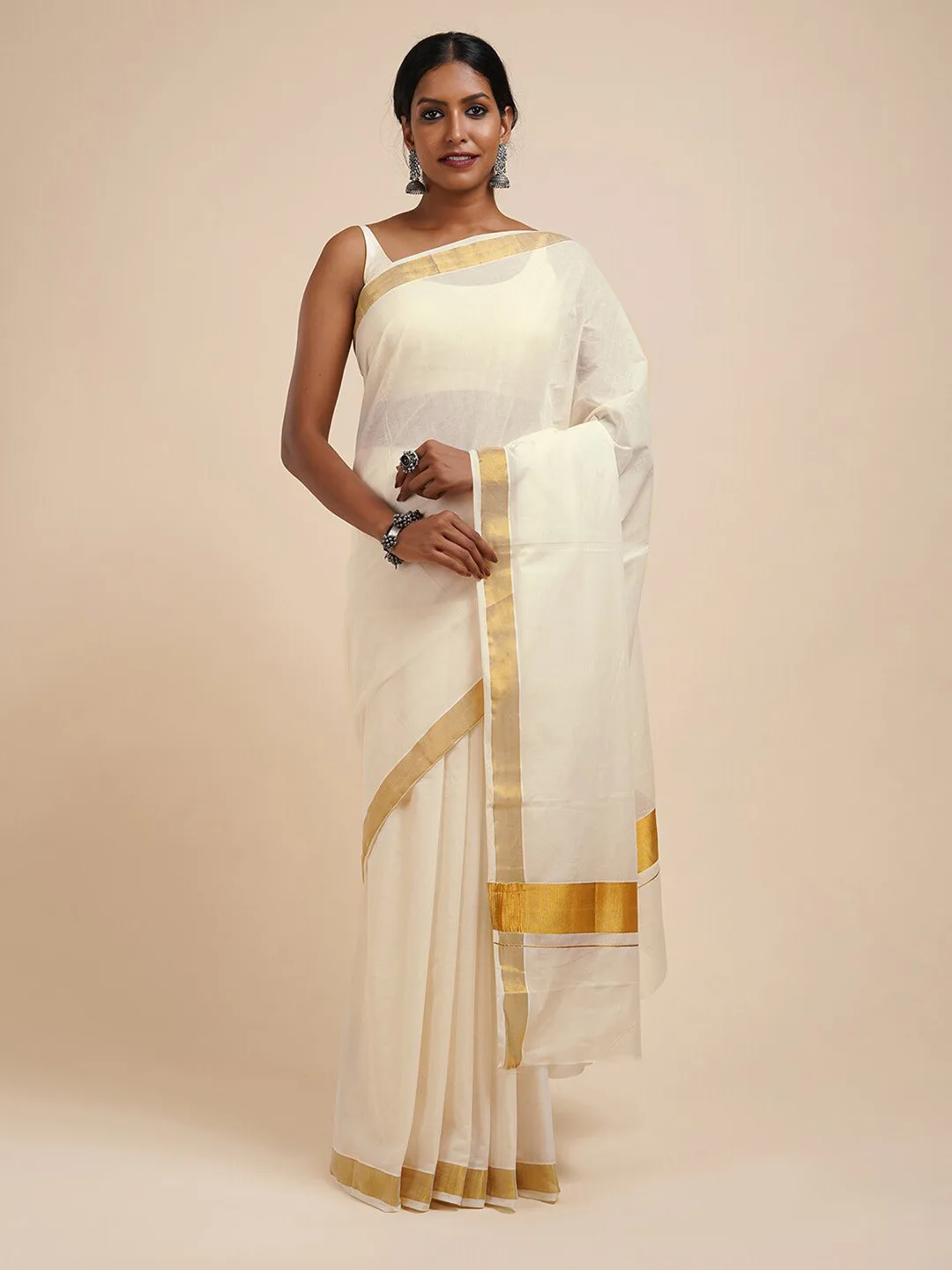 Our pick under ₹800 — white kasavu saree with a thin gold zari border