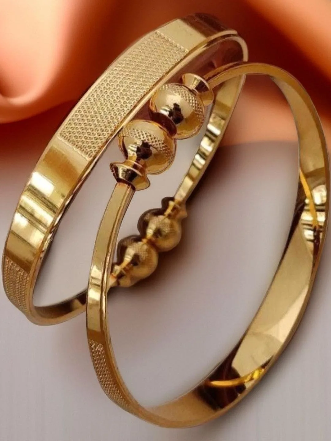 Jewels Kafe Slim gold-toned bangles, set of two