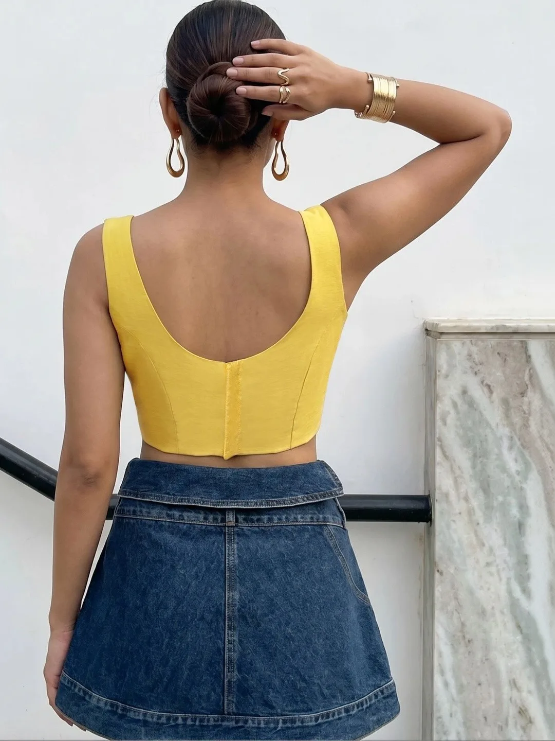 Aanyor Our pick under ₹700 — plain mustard sleeveless blouse, round neck