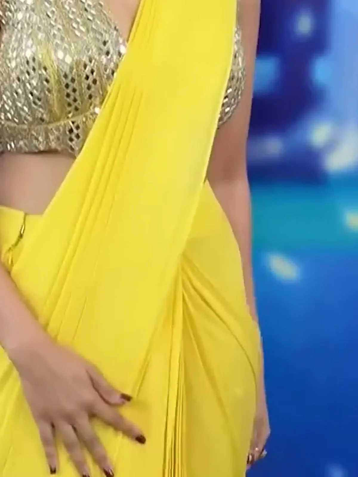 Nivetha Pethuraj — Up close: the pre-stitched pleats and the mirror columns at the hem of the blouse