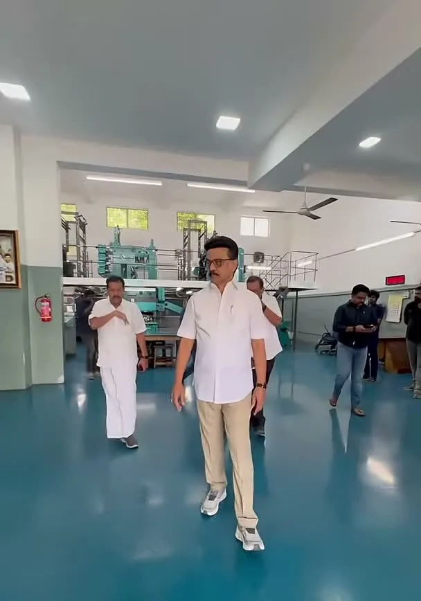 The factory-visit white shirt — Vijay