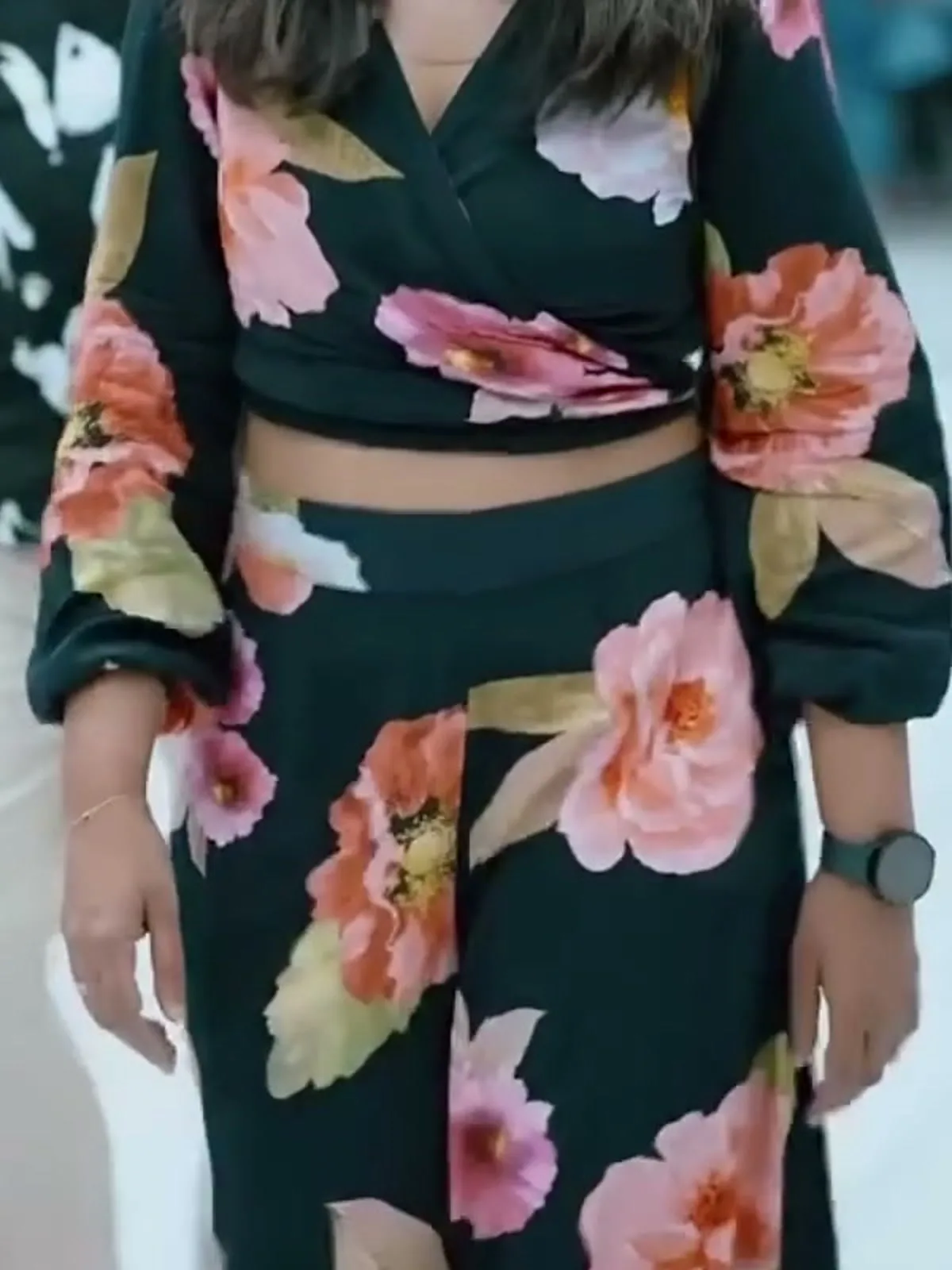 Shweta Mohan — Close on the waist — where the wrap ties, the band of midriff, and the palazzo waistband under it