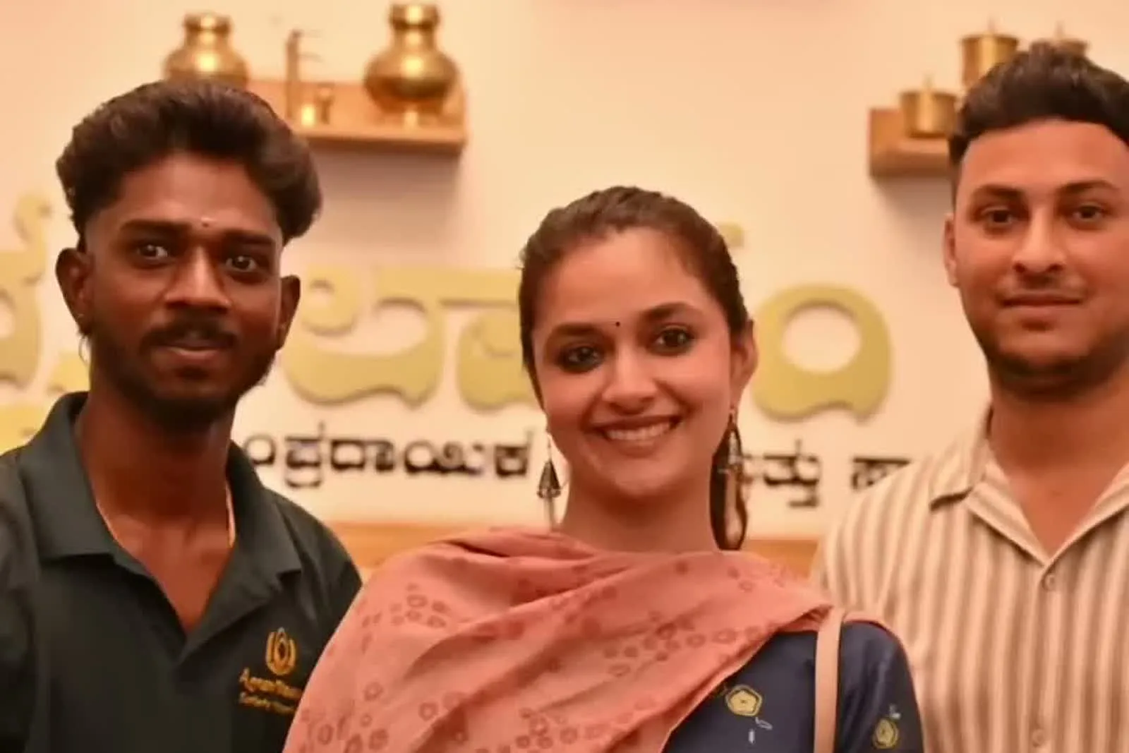 Keerthy Suresh — Front on, with the showroom staff — how sparsely the motifs sit across the whole front