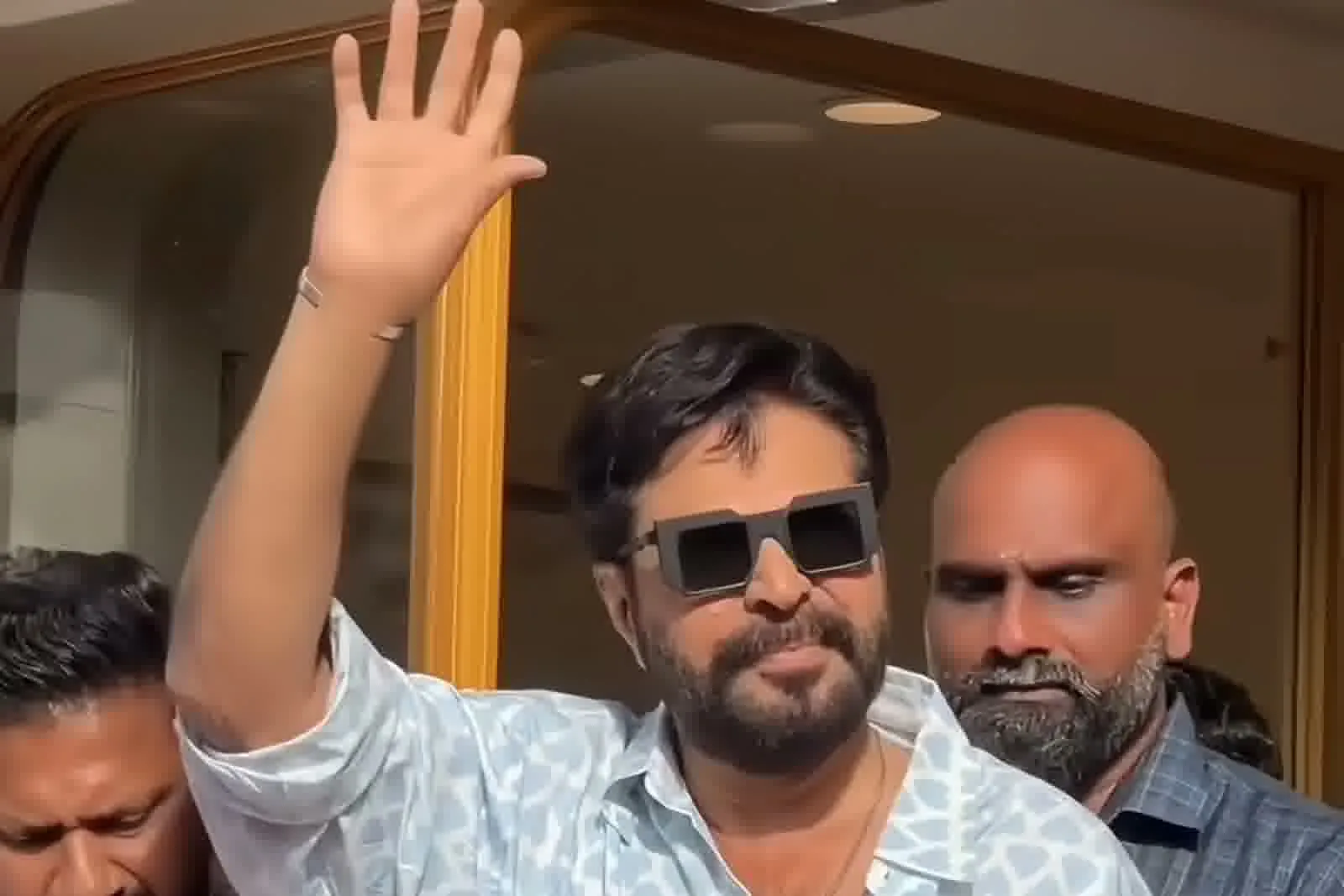 Mammootty — Arm up: how wide and straight the body of the shirt hangs off the shoulder