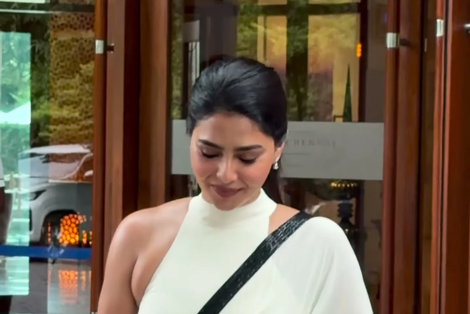 Aishwarya Lekshmi — Three-quarter: where the standing collar sits against the neck