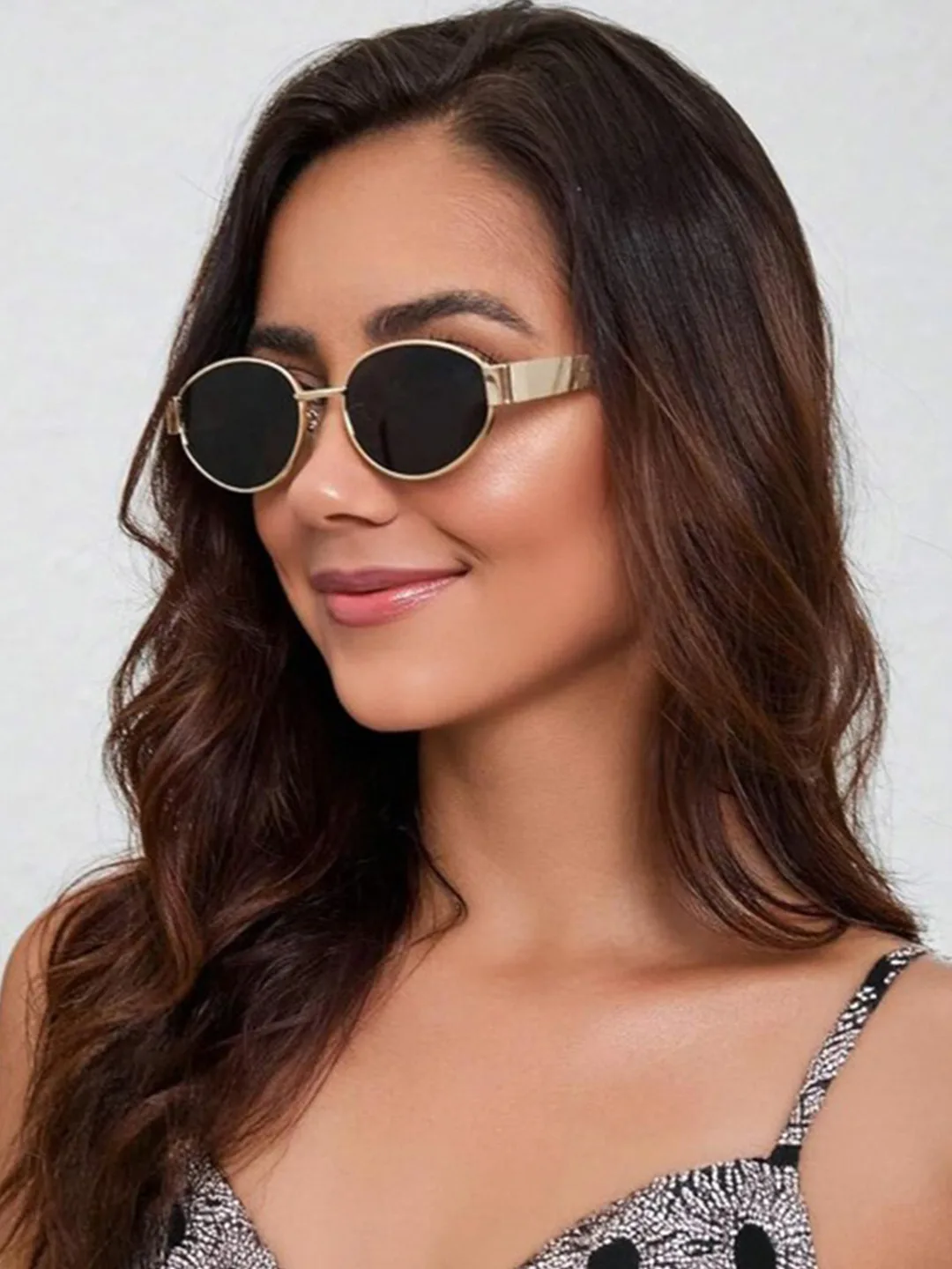 Small oval sunglasses, dark lens