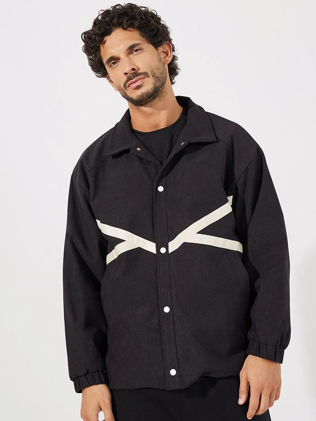 Styli Black coach jacket with cream contrast tape