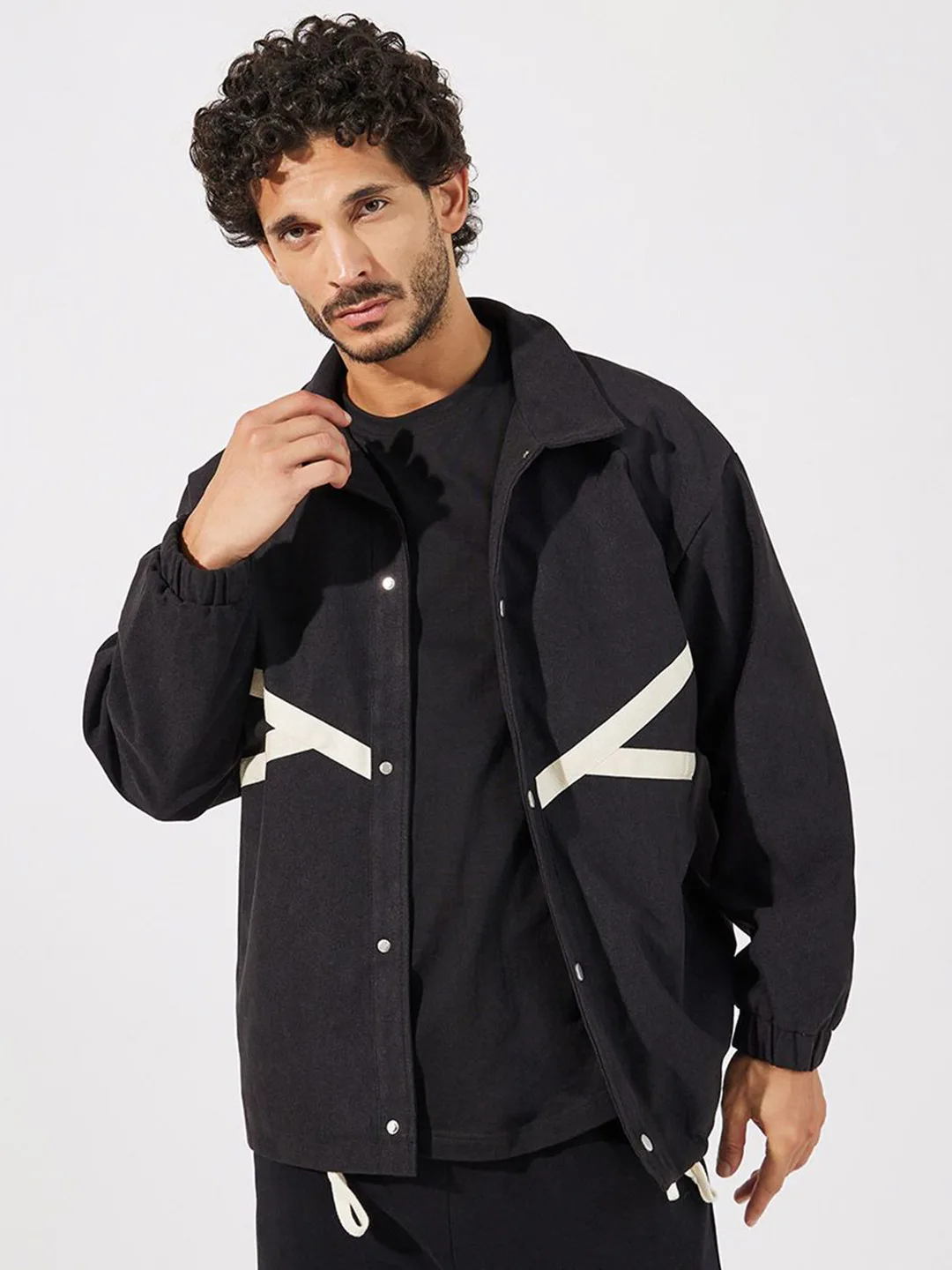 Styli Black coach jacket with cream contrast tape