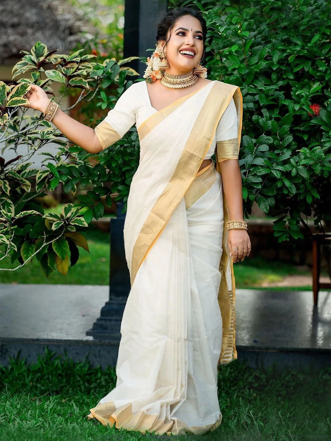 White silk-cotton saree with a gold zari border
