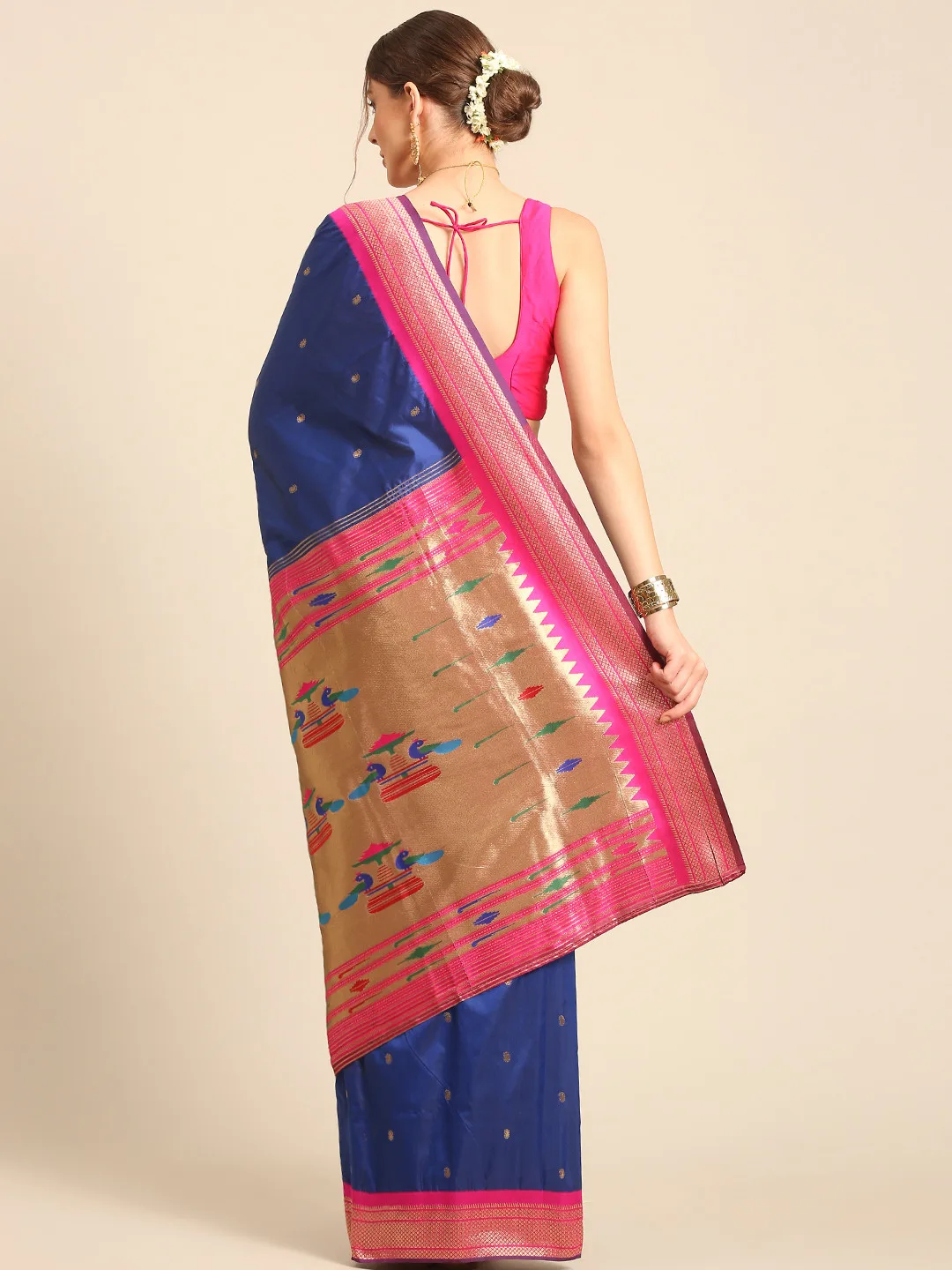 Royal Rajgharana Saree Royal blue silk saree with a pink zari border