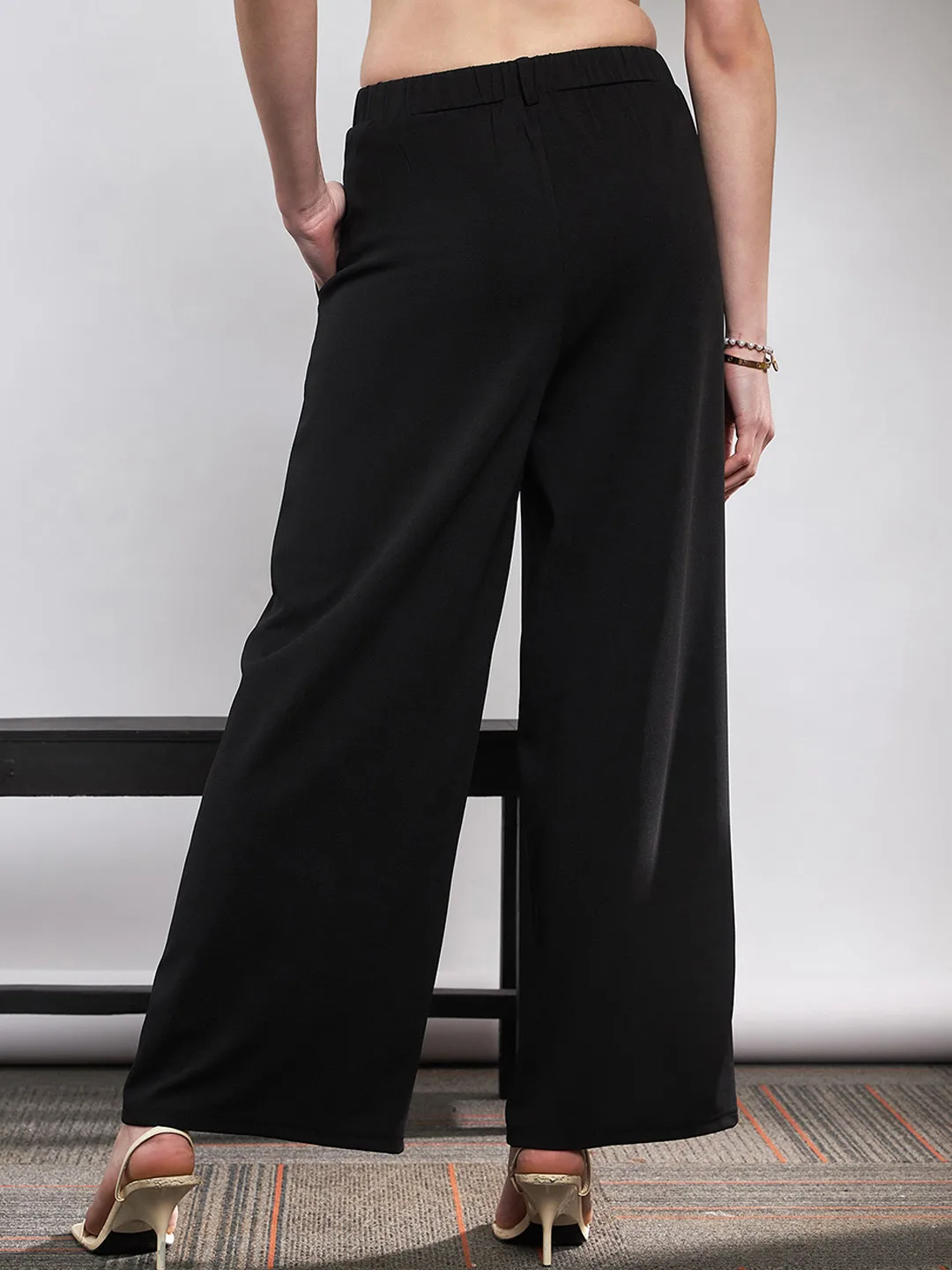 SASSAFRAS Black pleated wide-leg trousers