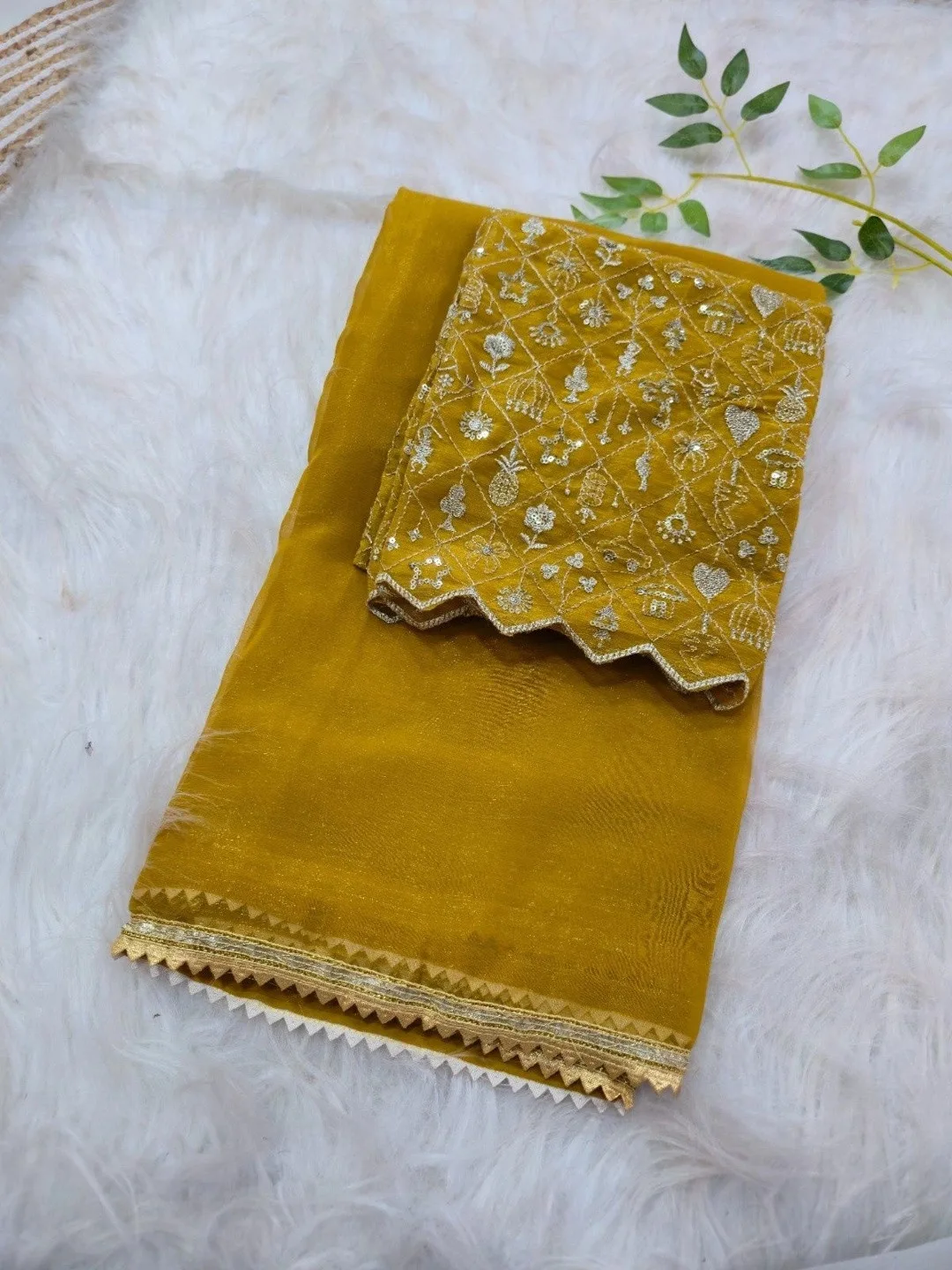 Shreevally Our pick under ₹750 — sheer yellow organza saree with a scalloped gold edge