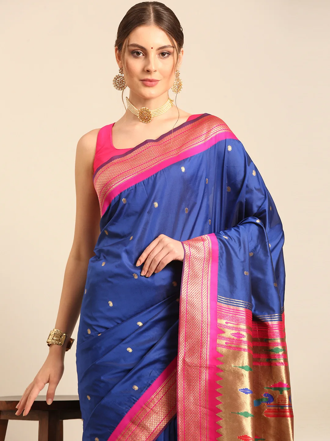Royal blue silk saree with a pink zari border
